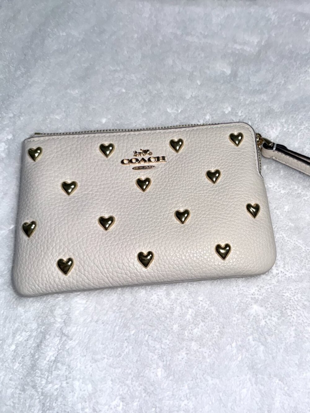 LIKE NEW Coach wristlet with gold metal hearts.  All 5-star reviews.  Fast ship.